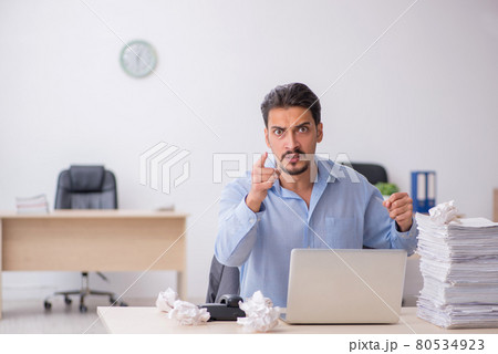 Young male employee rejecting new ideas in the office Young male employee rejecting new ideas in the office 80534923