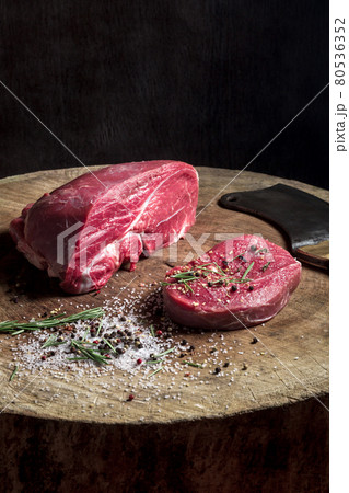 Juicy raw beef steak on wooden table Juicy raw beef steak on wooden table 80536352