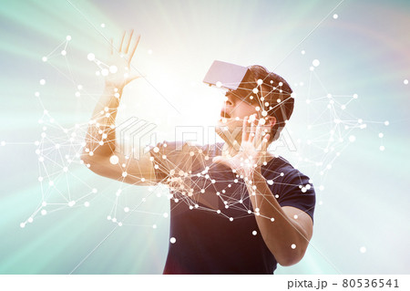 Man in neural network concept with VR glasses Man in neural network concept with VR glasses 80536541