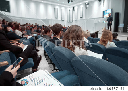 employees sitting in the conference room at the presentation of a new project . employees sitting in the conference room at the presentation of a new project . 80537131