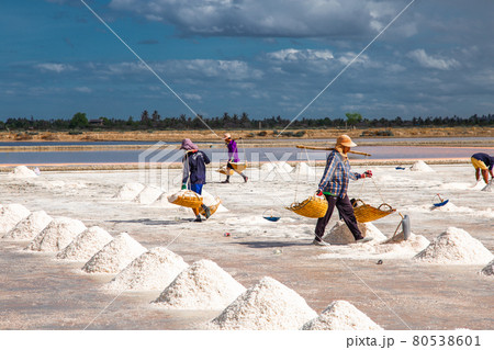 Phetchaburi Salt flats Naklua, farms and farmers collecting salt in Phetchaburi, Thailand Phetchaburi Salt flats Naklua, farms and farmers collecting salt in Phetchaburi, Thailand 80538601