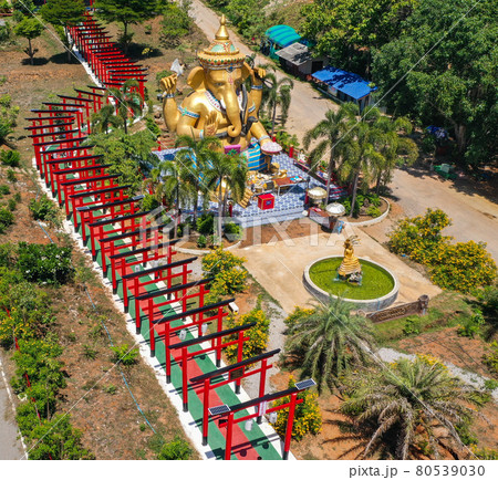 Wat Khao Sung Chaem Fa temple with giant snake and reclining gold buddha, in Kanchanaburi, Thailand 80539030