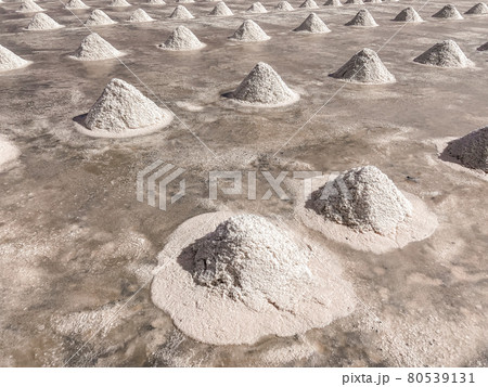Phetchaburi Salt flats Naklua, farms and farmers collecting salt in Phetchaburi, Thailand Phetchaburi Salt flats Naklua, farms and farmers collecting salt in Phetchaburi, Thailand 80539131