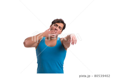 Man waking up with alarm clock isolated on white 80539402