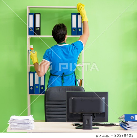Male handsome professional cleaner working in the office 80539405