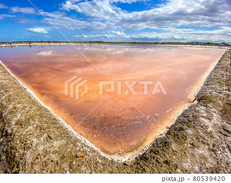 Phetchaburi Salt flats Naklua, farms and farmers collecting salt in Phetchaburi, Thailand 80539420