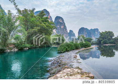 Sunset view of karst hills by Yulong River. Yangshuo. Sunset view of karst hills by Yulong River. Yangshuo. 80539805