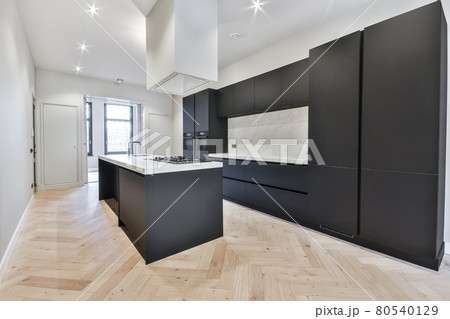 Interior of a beautiful kitchen of an elite house Interior of a beautiful kitchen of an elite house 80540129