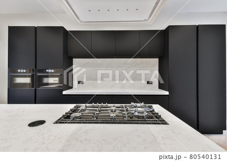 Interior of a beautiful kitchen of an elite house Interior of a beautiful kitchen of an elite house 80540131