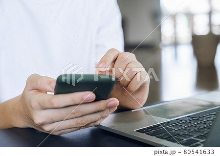 Close up of man using mobile phone. Close up of man using mobile phone. 80541633