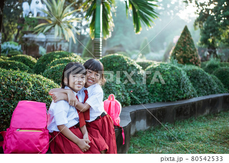 happy student friend in uniform smiling 80542533