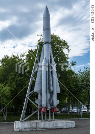 Mock up of a space rocket on a pedestal against the backdrop of a cloudy sky. Mock up of a space rocket on a pedestal against the backdrop of a cloudy sky. 80543645