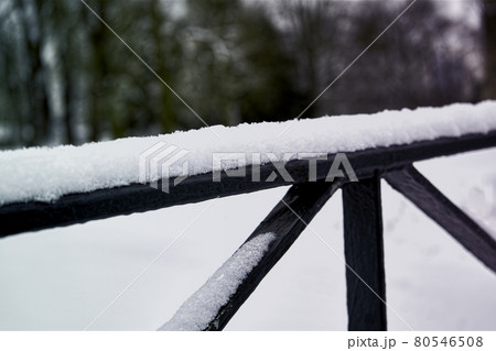 Abstract photo of iron struts covered with soft fresh snow 80546508
