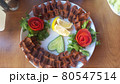 Cig kofte (raw meatball) with lettuce, tomato, pickle and lemon on the white plate. Turkish food Raw Meat ( Cig Kofte ) from traditional Turkish cuisine 80547514