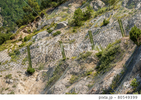 Rockfall Barrier with Wire Mesh in Mountain - Trentino Alto Adige Italy Rockfall Barrier with Wire Mesh in Mountain - Trentino Alto Adige Italy 80549399