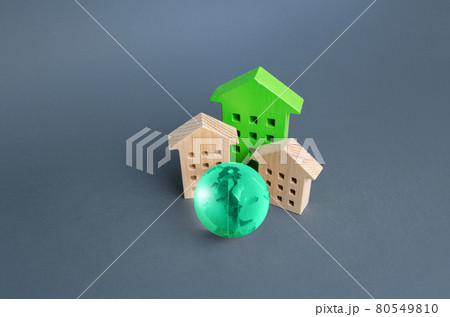 Residential buildings and green globe. Energy efficiency, zero carbon emissions. Environmentally friendly housing, minimal impact on environment. Carbon neutrality. Internet service communication. IoT Residential buildings and green globe. Energy efficiency, zero carbon emissions. Environmentally friendly housing, minimal impact on environment. Carbon neutrality. Internet service communication. IoT 80549810