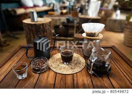 drip coffee on a wooden table at home 80549872