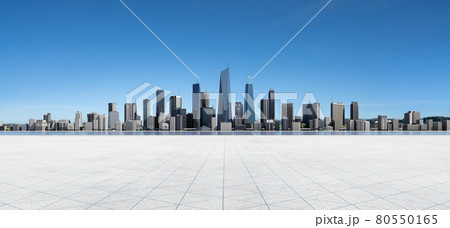 Panoramic view of empty concrete tiles floor with city skyline. Panoramic view of empty concrete tiles floor with city skyline. 80550165