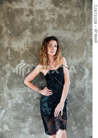 woman in a dress portrait on a gray background 80551971