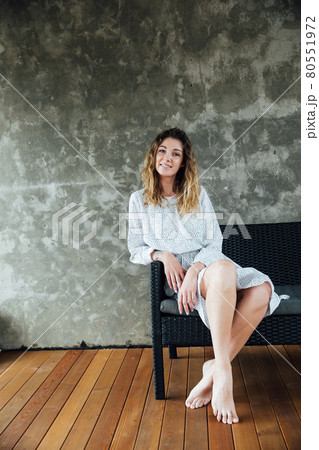 woman in a dress portrait on a gray background 80551972