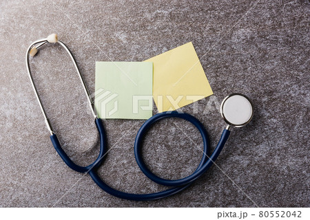 Doctor office table desk with blank paper stick note and stethoscope Doctor office table desk with blank paper stick note and stethoscope 80552042