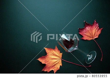Red wine glass and grape leaves autumn composition Red wine glass and grape leaves autumn composition 80553955