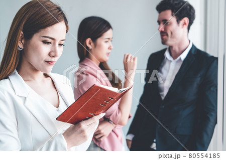 Businesswoman reading book in business office . 80554185