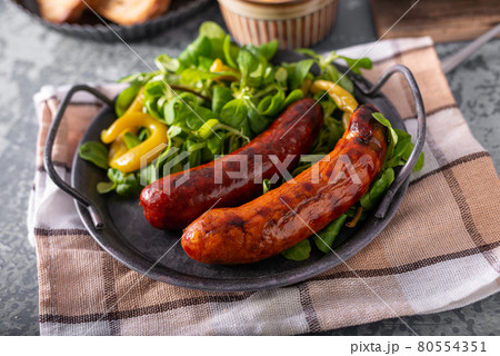 Grilled spicy sausages 80554351