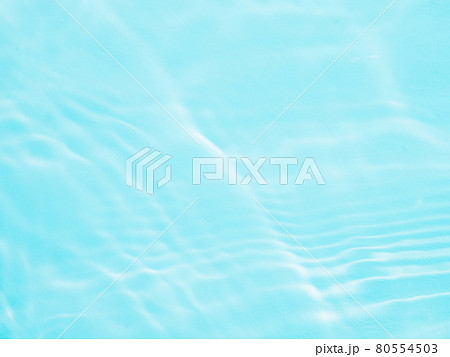 Ripple water texture with shadows on blue 80554503