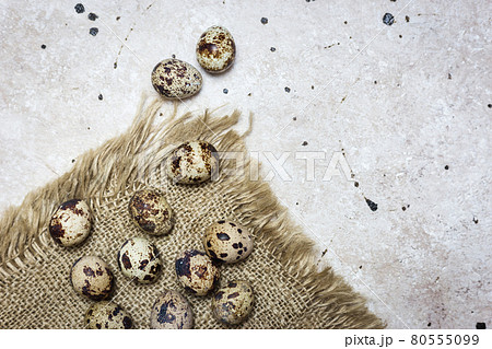 Quail eggs on light background 80555099