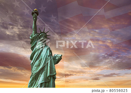 United States of America in Statue of Liberty on the background flag US the sunset United States of America in Statue of Liberty on the background flag US the sunset 80556025