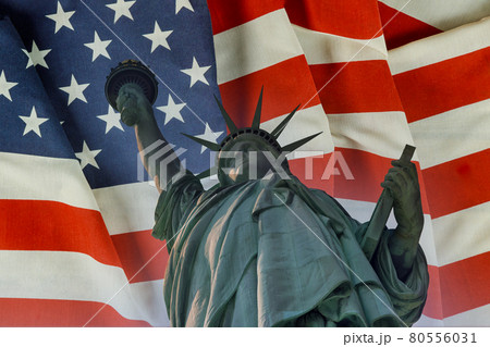 Statue of Liberty on the background flag United States New York, US 80556031
