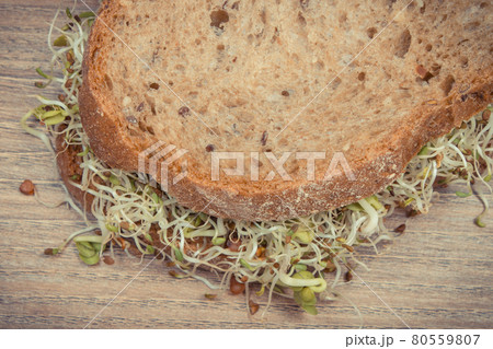 Alfalfa and radish sprouts with bread. Healthy addition to sandwiches. Source vitamins and minerals 80559807