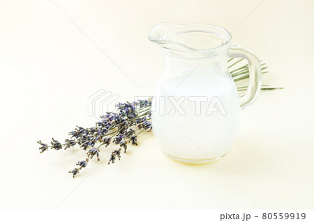 Yogurt or sour milk in jug with lavender flowers 80559919