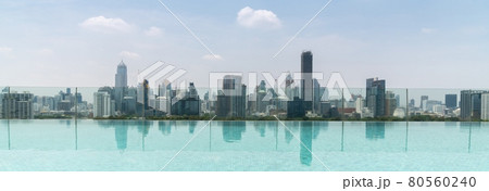 Cityscape and high-rise buildings in metropolis city with water reflection Cityscape and high-rise buildings in metropolis city with water reflection 80560240