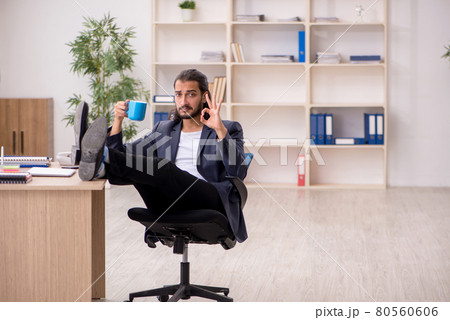 Young male employee working in the office 80560606