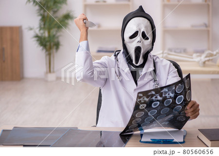 Devil doctor radiologist working in the clinic Devil doctor radiologist working in the clinic 80560656
