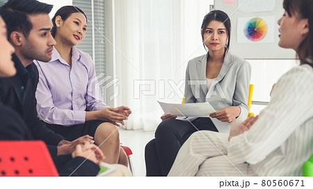 Business people proficiently discuss work project while sitting in circle Business people proficiently discuss work project while sitting in circle 80560671