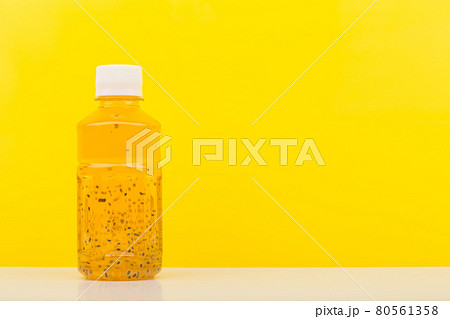 Detox drink or juice with chia seeds on white table against yellow background with copy space Detox drink or juice with chia seeds on white table against yellow background with copy space 80561358