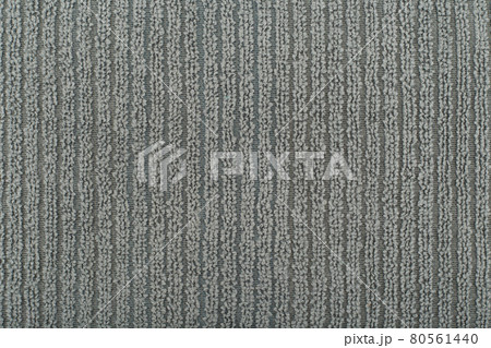 Grey flossy towel texture close up. Fluffy fabric with vertical stripes. 80561440