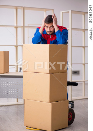 Young male contractor in movement concept at workplace Young male contractor in movement concept at workplace 80562047