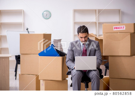 Young male employee in relocation concept Young male employee in relocation concept 80562858