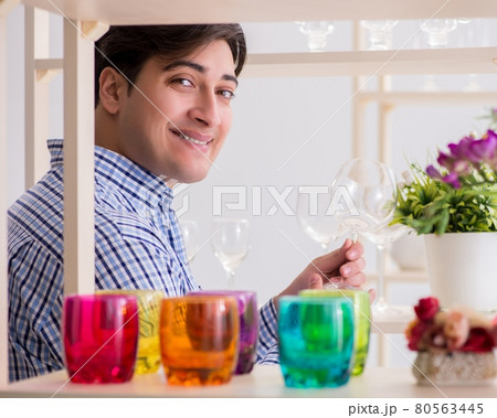 Young handsome man shopping in shop Young handsome man shopping in shop 80563445