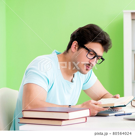 Student preparing for university exams at home 80564024