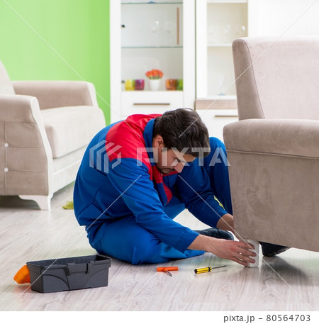 Repair contractor repairing broken furniture at home Repair contractor repairing broken furniture at home 80564703