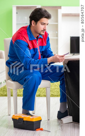 Repair contractor repairing broken furniture at home Repair contractor repairing broken furniture at home 80564707