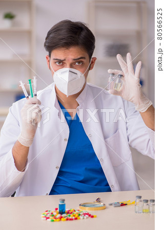 Young male doctor in vaccination concept Young male doctor in vaccination concept 80566525