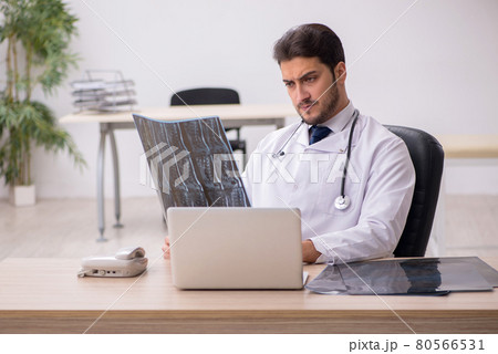 Young male doctor radiologist working in the clinic Young male doctor radiologist working in the clinic 80566531
