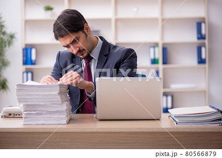 Young male employee working in the office 80566879