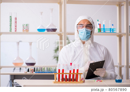 Young male chemist in drugs syntesis concept Young male chemist in drugs syntesis concept 80567890